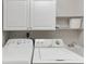 A close-up of the laundry machines and sink, showcasing functionality at 4534 Great Lakes S Dr, Clearwater, FL 33762