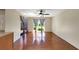 Living room with lots of space, hardwood floors, a ceiling fan, and sliding glass doors to the outdoors at 4534 Great Lakes S Dr, Clearwater, FL 33762