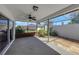 A covered patio is enclosed by screens and includes decorative stone and lush, mature landscaping at 4534 Great Lakes S Dr, Clearwater, FL 33762