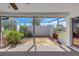 An enclosed back porch featuring decorative rock, pavers, and natural light at 4534 Great Lakes S Dr, Clearwater, FL 33762