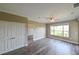 Cozy bedroom with wood floors, a ceiling fan, and ample closet space at 5000 Culbreath Key Way # 9-104, Tampa, FL 33611
