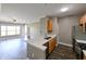 Modern kitchen with wood cabinets, stainless appliances, and stone countertops at 5000 Culbreath Key Way # 9-104, Tampa, FL 33611