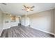 Open-concept living space with wood flooring and modern finishes at 5000 Culbreath Key Way # 9-104, Tampa, FL 33611