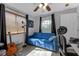 Bright bedroom with natural light, comfortable sofa, window, and stylish decor at 5634 Tanagergrove Way, Lithia, FL 33547