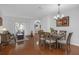 Bright dining room featuring hardwood floors, neutral paint, and access to the backyard at 5634 Tanagergrove Way, Lithia, FL 33547
