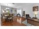 A living room featuring hardwood floors, neutral paint, and stylish furniture at 5634 Tanagergrove Way, Lithia, FL 33547