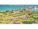 Beautiful aerial view of a lakeside condo community with lush green lawns, ponds and water views at 6131 Bahia Del Mar Blvd # 240, St Petersburg, FL 33715