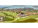 An aerial view of a lakeside community with lush green lawns, water features and waterfront access at 6131 Bahia Del Mar Blvd # 240, St Petersburg, FL 33715