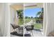 Balcony with seating, overlooking a pristine golf course with lush greenery and blue skies at 6131 Bahia Del Mar Blvd # 240, St Petersburg, FL 33715