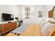 Bright bedroom featuring a comfortable bed, wooden dresser, and natural light from the window at 6131 Bahia Del Mar Blvd # 240, St Petersburg, FL 33715