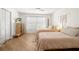 Guest bedroom featuring twin beds, natural light, and wood-look flooring at 6131 Bahia Del Mar Blvd # 240, St Petersburg, FL 33715