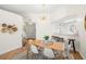 Bright dining area with modern light fixture and seating for four, adjacent to the kitchen and entryway at 6131 Bahia Del Mar Blvd # 240, St Petersburg, FL 33715