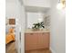 Hallway area with cabinet and entryway into main bedroom at 6131 Bahia Del Mar Blvd # 240, St Petersburg, FL 33715