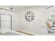 Galley kitchen with white cabinets, featuring a large clock at 6131 Bahia Del Mar Blvd # 240, St Petersburg, FL 33715