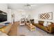 Inviting living room featuring neutral decor, wood-look floors, and an open floor plan at 6131 Bahia Del Mar Blvd # 240, St Petersburg, FL 33715