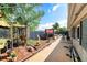 View of the backyard featuring a small patio area with lush foliage at 6821 Tierra Verde St, Port Richey, FL 34668