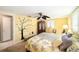 Comfortable bedroom featuring a decorative wall-art and an elegant ceiling fan with leaf-shaped blades at 6821 Tierra Verde St, Port Richey, FL 34668