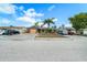 Charming single-story home featuring a well-kept front yard with mature landscaping and a spacious driveway at 6821 Tierra Verde St, Port Richey, FL 34668