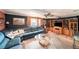 Cozy living room featuring comfortable seating and wood shutters at 6821 Tierra Verde St, Port Richey, FL 34668