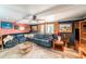 Comfortable living room with a sectional sofa and charming decor at 6821 Tierra Verde St, Port Richey, FL 34668
