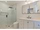 Modern bathroom featuring a sleek glass shower and a stylish vanity with contemporary fixtures and ample storage at 7120 3Rd N Ave, St Petersburg, FL 33710