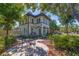 Beautiful home exterior with a welcoming patio area, lush landscaping, and a charming curb appeal at 7120 3Rd N Ave, St Petersburg, FL 33710