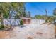 Spacious two-car garage and ample parking space, enclosed by a white privacy fence at 7120 3Rd N Ave, St Petersburg, FL 33710