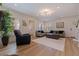 Inviting living room featuring hardwood floors, comfortable seating, and natural light from large windows at 7120 3Rd N Ave, St Petersburg, FL 33710