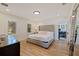 Relaxing main bedroom with large bed, plantation shutters, hardwood floors, and ensuite office at 7120 3Rd N Ave, St Petersburg, FL 33710