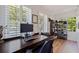 Bright home office with ample natural light, generous desk space, and stylish shoe storage at 7120 3Rd N Ave, St Petersburg, FL 33710