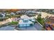 Aerial view of a waterfront property with a three-car garage and pristine landscaping at 744 Spanish Main Dr, Apollo Beach, FL 33572