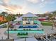 Aerial view of a waterfront house with a pool, outdoor kitchen, and manicured lawns at 744 Spanish Main Dr, Apollo Beach, FL 33572