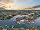 Wide aerial view of a waterfront community showcasing the canals, homes, and tropical landscaping at 744 Spanish Main Dr, Apollo Beach, FL 33572
