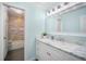 Bright bathroom featuring a single sink with a marble countertop, and a bathtub/shower at 744 Spanish Main Dr, Apollo Beach, FL 33572