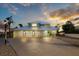 Charming home with a three-car garage, spacious driveway, and manicured lawn at 744 Spanish Main Dr, Apollo Beach, FL 33572