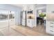 Well-lit kitchen with stainless steel appliances, white cabinets, and a sliding door to the outdoor pool at 744 Spanish Main Dr, Apollo Beach, FL 33572