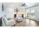 Bright living room with a beverage bar, white cabinets, beverage coolers, and French doors opening to the outdoors at 744 Spanish Main Dr, Apollo Beach, FL 33572