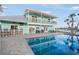 Backyard pool and entertaining area of this waterfront home at 744 Spanish Main Dr, Apollo Beach, FL 33572