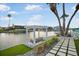 Swing facing the canal adds charm to this waterfront home at 744 Spanish Main Dr, Apollo Beach, FL 33572