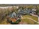 Majestic homes showcased in an aerial shot by the serene waterfront community at 7740 Blue Spring Dr, Land O Lakes, FL 34637