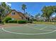 Community basketball court for recreational activities with basketball hoop and green playing surface at 7740 Blue Spring Dr, Land O Lakes, FL 34637