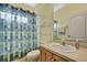 Traditional bathroom featuring a sink, toilet and shower/tub combination at 7740 Blue Spring Dr, Land O Lakes, FL 34637