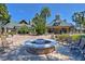 Gather around this charming fire pit in a comfortable community outdoor space at 7740 Blue Spring Dr, Land O Lakes, FL 34637