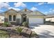 Charming single-story home boasting a two-car garage and beautiful stone accents at 7740 Blue Spring Dr, Land O Lakes, FL 34637