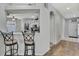 Open kitchen with a breakfast bar that offers a view into adjacent living spaces at 7740 Blue Spring Dr, Land O Lakes, FL 34637