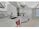 Bright kitchen with white cabinets, stainless steel appliances and an open concept design at 7740 Blue Spring Dr, Land O Lakes, FL 34637