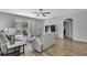 Inviting living space with hardwood floors, modern furniture, and sliding door access at 7740 Blue Spring Dr, Land O Lakes, FL 34637