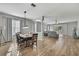 Open-concept living area with hardwood floors and plentiful natural light at 7740 Blue Spring Dr, Land O Lakes, FL 34637