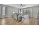 Comfortable living room showcasing hardwood floors and sliding door access to a patio at 7740 Blue Spring Dr, Land O Lakes, FL 34637