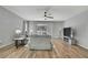 Bright living room featuring hardwood floors, a ceiling fan, and a sliding glass door at 7740 Blue Spring Dr, Land O Lakes, FL 34637